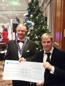 Paul Brown receiving cheque from Michael Jennings